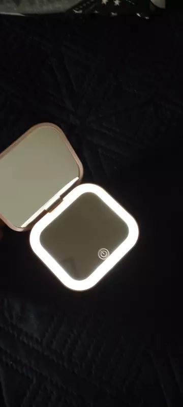 Small mirror with lights